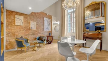 Premium Duplex, 1 Bedroom | Living area | 100-cm flat-screen TV with cable channels, TV