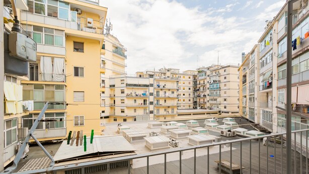 A rooftop terrace with multiple air conditioning units and a metal railing. - Casa Campione by Wonderful Italy (Bari)