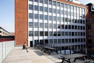 A modern building with a brick facade and large windows.