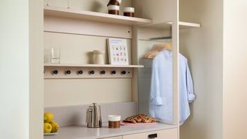 A kitchen with a countertop, a coffee maker, a loaf of bread, and a book titled "Anna Jones Easy Wins".