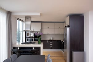Grand Apartment | Private kitchen | Stovetop, dishwasher, coffee/tea maker, toaster