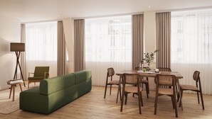 A modern living room with a green sofa, wooden dining table, and chairs. - Bob W London St. Paul's (London)