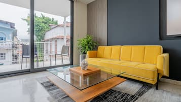 Appartement Exclusif | Coin séjour | TV connectée de 40 pouces avec chaînes par câble
