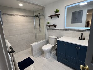 Shower, hair dryer, towels, soap