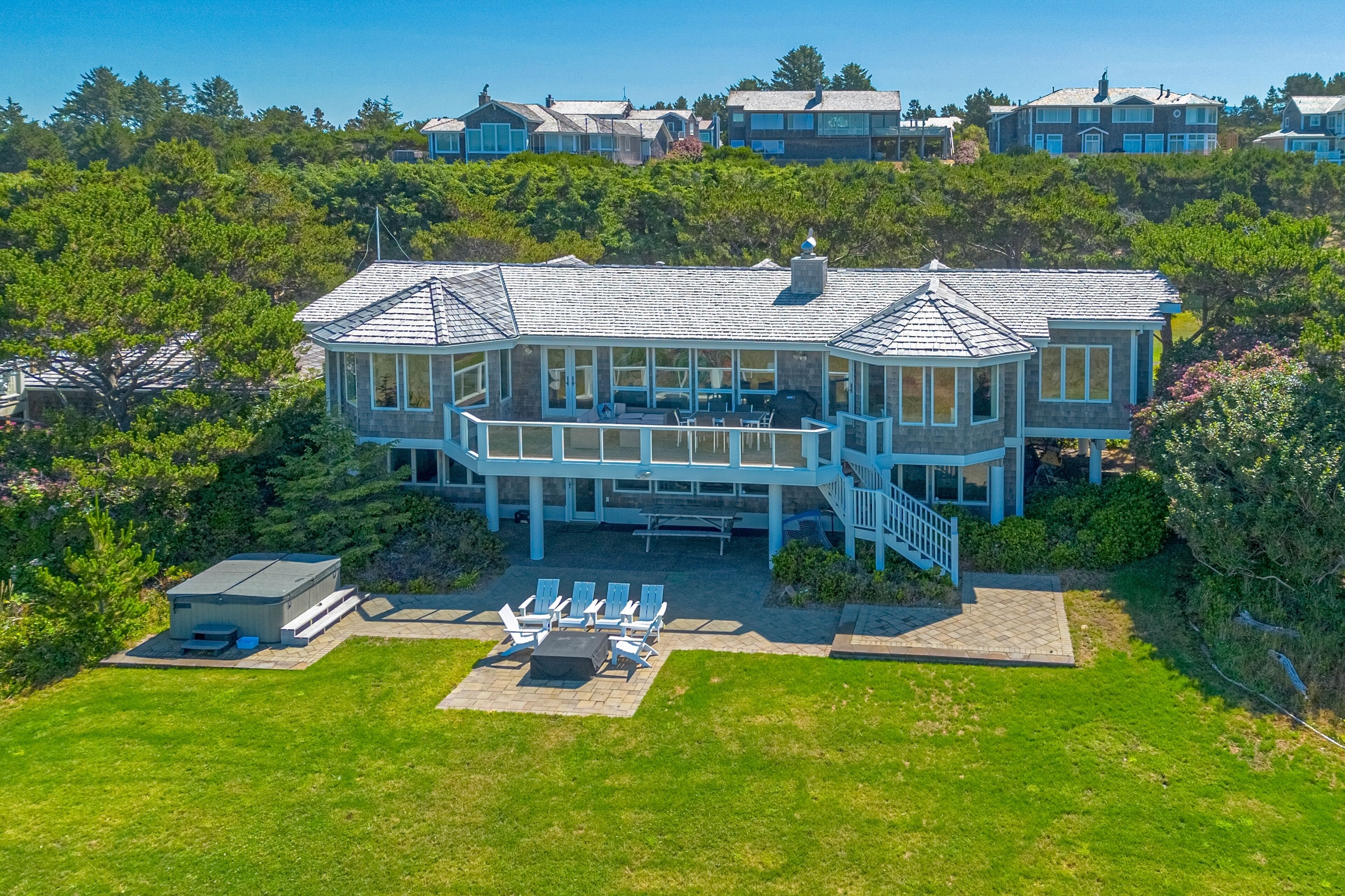 Oceanfront estate in a gated community with hot tub, firepit & amazing views
