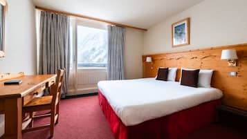 Verduisterende gordijnen, gratis wifi, beddengoed