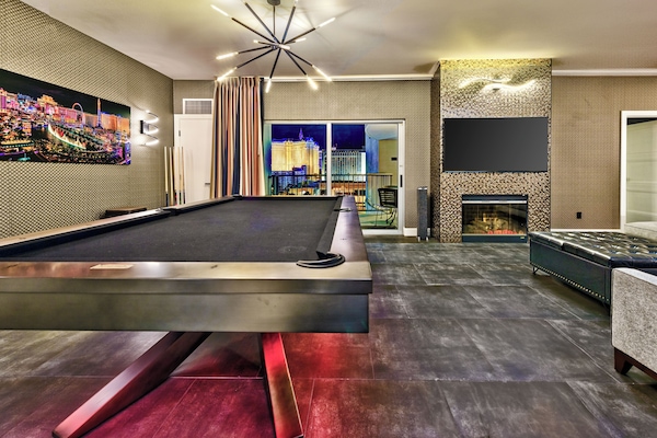Black stainless steel regulation size pool table.