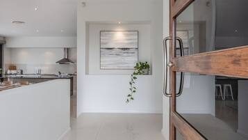 Fridge, dishwasher, coffee/tea maker, dining tables