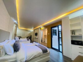 Habitación familiar | Ropa de cama de alta calidad y edredones de plumas