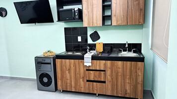 Fridge, microwave, stovetop, coffee/tea maker