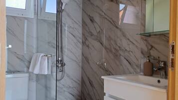 Shower, hair dryer, towels, toilet paper