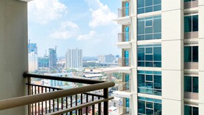 A modern building with multiple balconies and large windows. - Good Deal And Elegant Studio Tamansari Iswara Apartment (Bekasi)