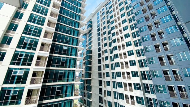 A modern high-rise building with multiple balconies and large windows. - Good Deal And Elegant Studio Tamansari Iswara Apartment (Bekasi)