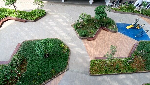 A landscaped courtyard with planters, a playground, and a pathway. - Fully Furnished Studio At 11Th Floor Tokyo Riverside Pik 2 Apartment (Teluknaga)