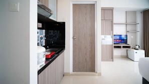 Studio | Private kitchen | Full-sized fridge, stovetop - Clean And Cozy Stay Studio At Taman Melati Surabaya Apartment (Surabaya)