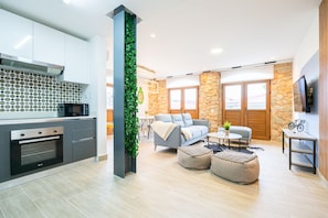 Executive Apartment | Living area | 40-inch Smart TV with cable channels