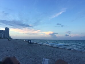 On the beach, sun loungers, beach towels