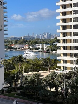 A high-rise building with balconies overlooking a marina with boats. - Spacious Beachfront Retreat,
Family Friendly,
Free parking/Free Public Trolley (Miami Beach)
