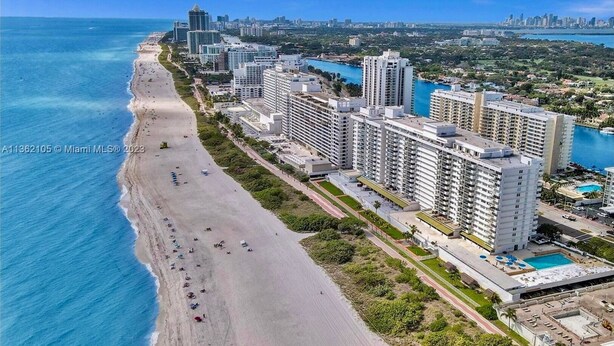 An aerial view of a coastal area with a beach, high-rise buildings, and a clear blue sky. - Spacious Beachfront Retreat,
Family Friendly,
Free parking/Free Public Trolley (Miami Beach)