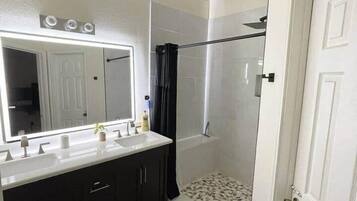 Shower, hair dryer, soap, shampoo