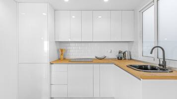 Fridge, microwave, stovetop, coffee/tea maker