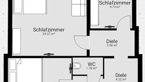 A floor plan of a hotel with two bedrooms, a bathroom, a kitchen, and a dining area. - 3 Bedrooms - 74sqm - 10 Min. Inner City (Vienna)