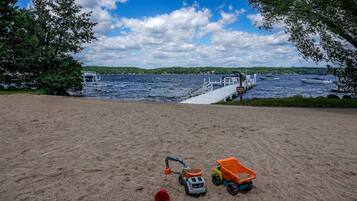 Enjoy a serene lakeside retreat with a dock and stunning views of the surrounding natural landscape.