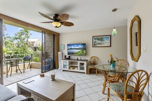 Condo, 1 King Bed with Sofa bed, Pool Access, Garden View | Living area | 50-inch flat-screen TV with cable channels, TV