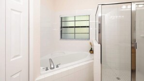 Condo, Multiple Beds, Balcony, Garden View (Sunset Serenity at Caribe Cove Resort) | Bathroom - Tropical 2 BDR Condo in Brand New Resort Community (Kissimmee)