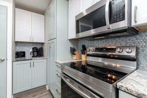 Condo, Multiple Beds, Balcony, Partial Ocean View (Beachin Rides) | Private kitchen | Fridge, microwave, oven, stovetop