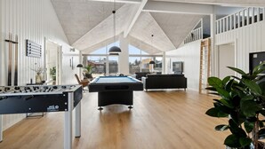 A spacious living area with a pool table, a foosball table, and a modern interior design. - Awesome home in ålbæk with WiFi (Ålbæk)