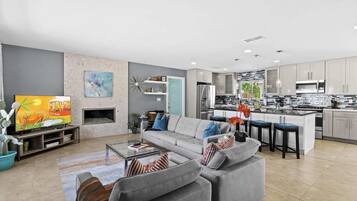 House, Multiple Beds, Pool Access, Pool View (Tiki Time Getaway) | Living area | 50-inch flat-screen TV with digital channels, fireplace