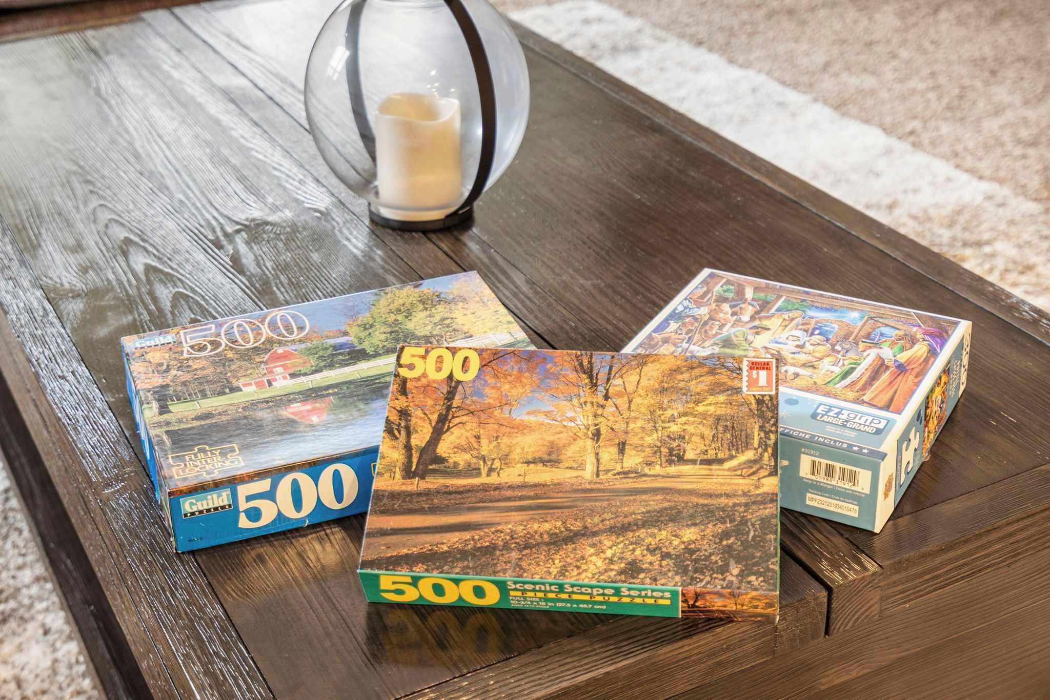 Three books titled '500' on a wooden table.