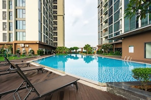 Outdoor pool, open 6:00 AM to 9:00 PM, sun loungers, lifeguards on site