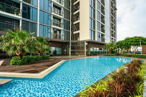 Outdoor pool, open 6:00 AM to 9:00 PM, pool loungers, lifeguards on site - Eco Green Apartment- Minimalist Home (Ho Chi Minh City)