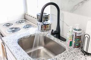 Fridge, stovetop, coffee/tea maker, toaster