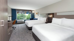 A hotel room with two beds, a desk, a chair, and a large window with a view of trees. - Holiday Inn Express & Suites Reedsburg - Dells Area by IHG (Reedsburg)