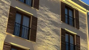 A multi-story building with balconies, large windows, and a textured facade. - Sareban Hotel Istanbul  (Istanbul)