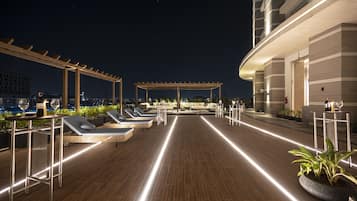 Outdoor pool, open 7:00 AM to 8:00 PM, free cabanas, pool umbrellas