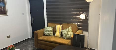 Exclusive Apartment | Living area | Flat-screen TV