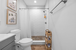Shower, hair dryer, towels, shampoo