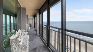 A balcony with a view of the ocean and beach. - Oceanfront 1BR Penthouse with Breathtaking Views (Myrtle Beach)