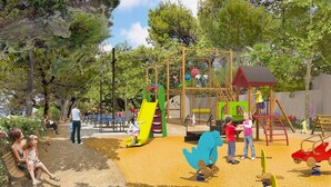 A playground with climbing structures, slides, and a covered play area. - Bungalow Neuf Superbe Terrasse Plein sud Face mer à l' ile d' or Camping 4 (Saint-Raphaël)
