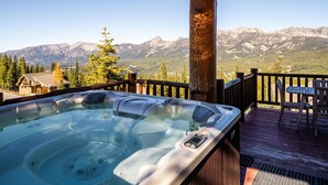 A hot tub on a wooden deck with a mountain view. - 3 Bandit Way 4 Bedroom Home by Moonlight Basin Lodging (Big Sky)