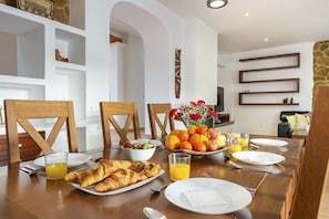 Enjoy a delicious breakfast at this stylish dining area, complete with a beautifully set table and a variety of tasty treats.