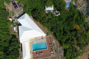 Exterior - A true oceanfront villa with amazing sunsets and pool. Very nice location. (St. Thomas)