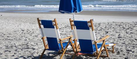On the beach, sun loungers, beach towels