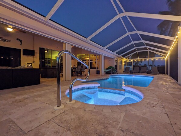 Outdoor pool, a heated pool - Luxury south facing waterfront home with heated salt pool and spa! (Cape Coral)