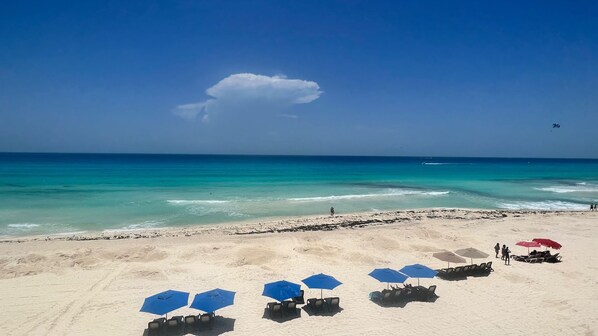 On the beach, sun-loungers, beach towels