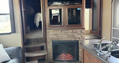 Cozy RV tucked back in a quiet property with plenty of room to relax